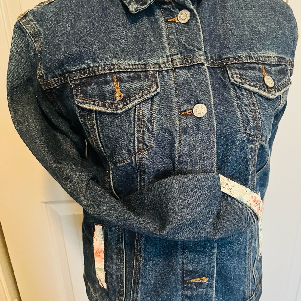 Thrifted jeans jacket decorated to be  again.